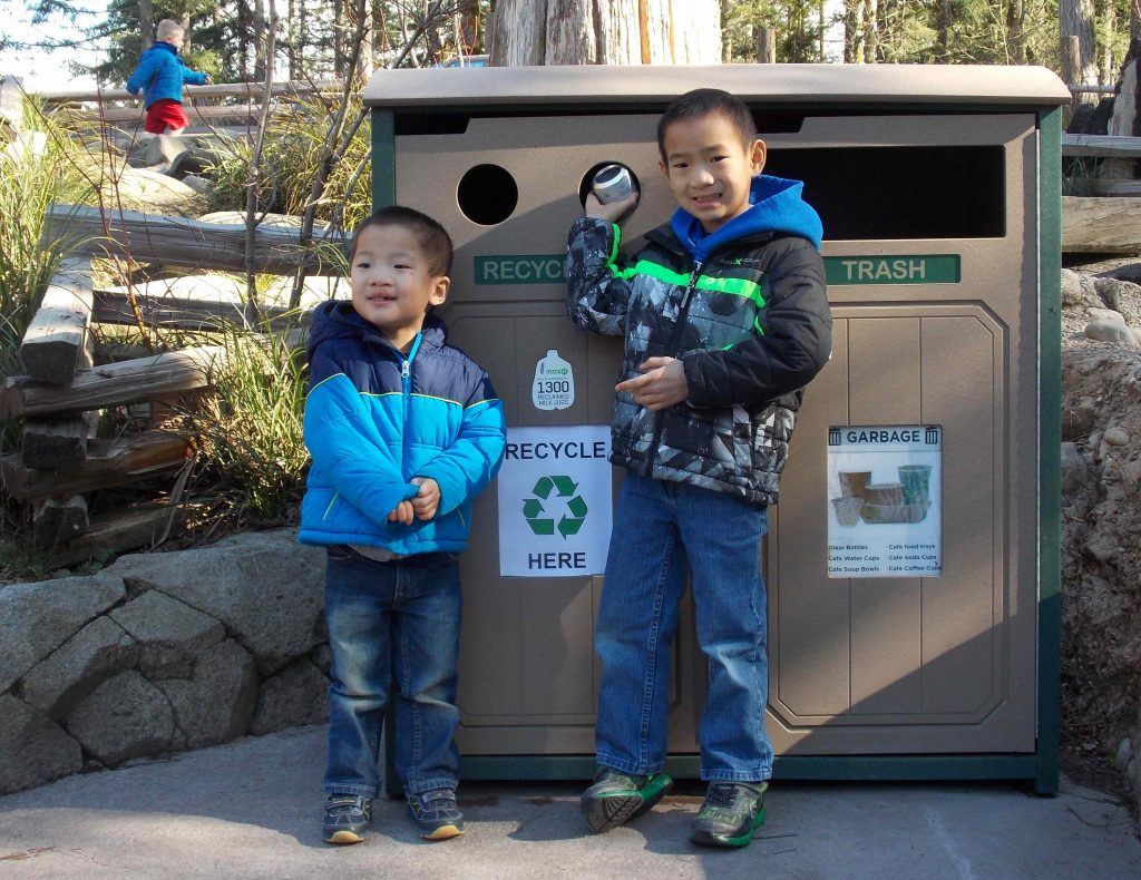 Two kids recycling at Northwest Trek