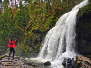 hiker near waterfall